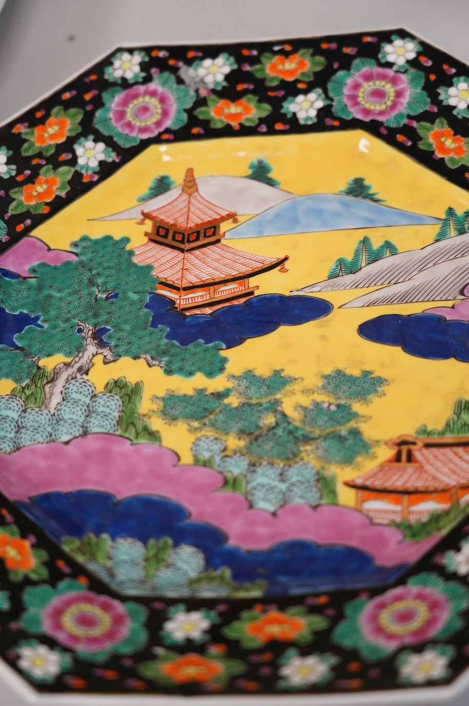 Oriental ceramics to include a Chinese yellow ground charger and a large famille noire vase, 47cm high (6). Condition - yellow charger chipped on rim, bird plate, glaze browned near centre, other four items good